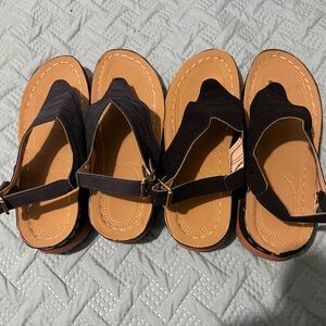 Sandals. 2 pairs. 1 blue and 1 white. Wrap around strap in back. Brand new!